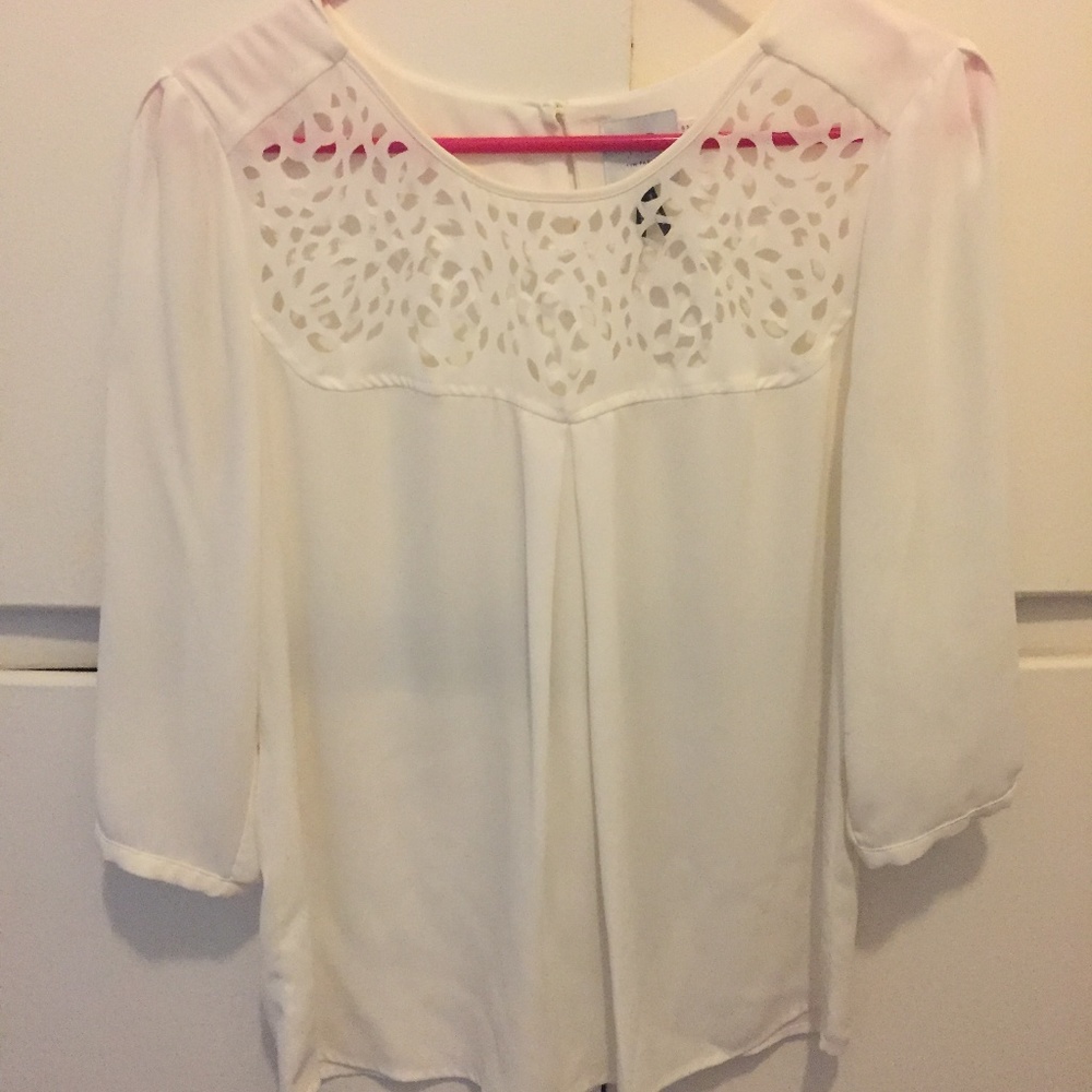 White blouse with laser cut detail